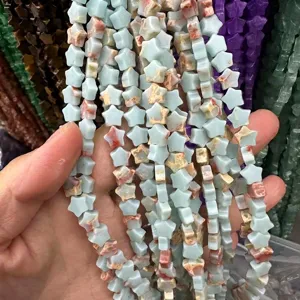 Detail shot of light blue star-shaped natural stone beads for DIY jewelry crafts