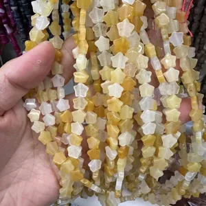 Close-up detail of 8mm star-shaped yellow agate natural stone beads for DIY jewelry