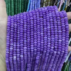 Close-up of 4x6mm purple abacus stone beads for DIY jewelry making accessories.