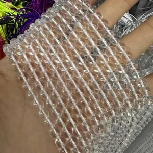 Close-up of clear white quartz crystal round loose beads for DIY jewelry making