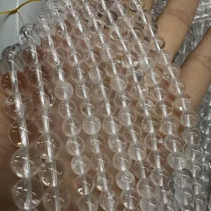 Detail view of transparent natural white crystal round beads for DIY jewelry making
