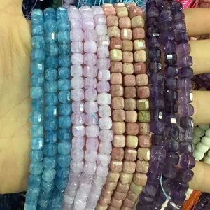 Close-up of 6mm faceted natural stone cube beads in multiple vibrant colors for DIY