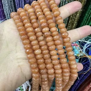 Macro detail of faceted natural orange stone abacus beads for DIY jewelry making crafts