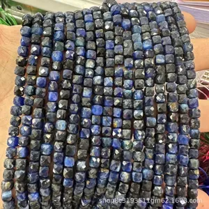 Detailed macro view of 6mm faceted natural stone cube beads in blue for DIY jewelry making