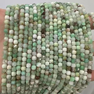Detailed view of 6mm faceted green natural stone cube beads for DIY jewelry making