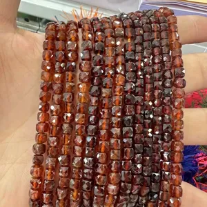Detailed view of 6mm faceted natural stone cube beads in amber agate for DIY jewelry making