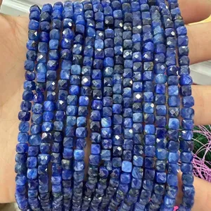 Macro detail view of 6mm faceted blue natural stone cubic beads for jewelry DIY projects