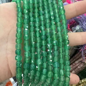 Macro view of 6mm faceted green natural stone agate cube beads for DIY jewelry making