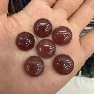 Close-up of natural strawberry quartz round cabochons showing internal inclusions