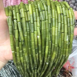 Detail macro view of 4x13mm green emperor stone cylindrical tube beads for DIY jewelry