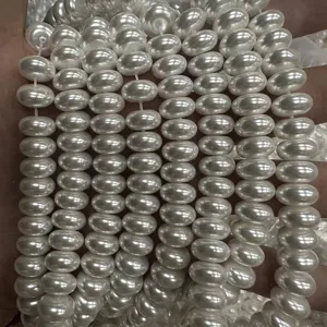 Close-up detail of 6x10mm white abacus-shaped imitation pearl beads for DIY jewelry