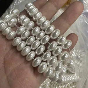 Detailed view of 6x10mm white oval imitation pearl beads for DIY jewelry crafts