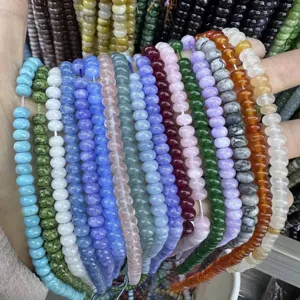 Close-up detail of assorted 4x6mm natural stone abacus spacer beads for DIY jewelry making