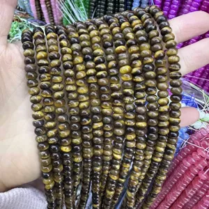 Macro view of 4x6mm natural tiger eye stone abacus beads with distinct chatoyancy