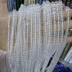 Detail macro view of clear 4x6mm crystal abacus beads for DIY jewelry making.