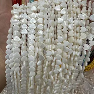 Close-up detail of natural heart-shaped white mother of pearl shell beads