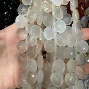 Close-up of heart-shaped faceted white natural agate beads for DIY jewelry making