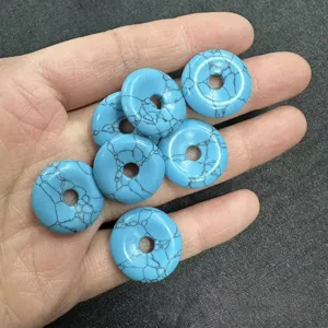 Close-up of 20mm blue turquoise style donut stone beads for DIY jewelry accessories