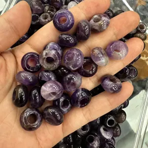Close-up of natural amethyst rondelle beads with large holes for DIY jewelry making