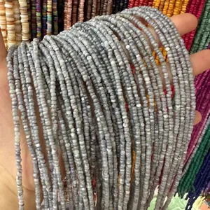 Close-up detail of 3mm natural irregular grey shell disc spacer beads for DIY jewelry making.