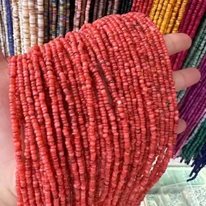 Close-up detail of 3mm red natural shell spacer heishi beads for DIY jewelry making