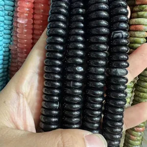 Detail shot of 4x12mm black natural stone spacer beads for handmade jewelry making