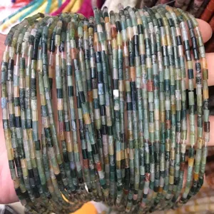 Detailed macro view of 2x4mm multi-colored natural stone cylinder beads for DIY jewelry