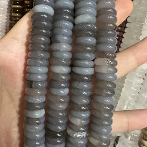 Macro detail of 4x12mm natural gray agate rondelle spacer beads for DIY jewelry crafts