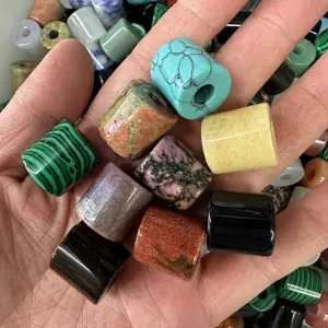 Colorful 9x9mm natural stone cylinder beads for DIY jewelry making displayed in palm