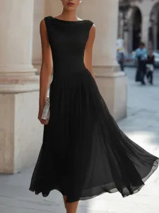 Elegant cowl neck detail and pleated skirt silhouette showcased in a chic urban street scene.