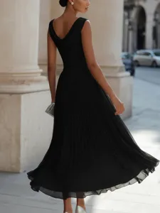 Detailed view of elegant black cowl neck pleated party dress, sleeveless vacation maxi design.