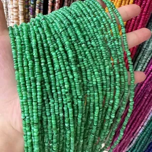 Close-up view of 3mm natural green shell disc spacer beads for DIY jewelry making