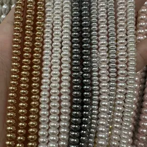 Macro detail of high-gloss imitation pearl abacus beads in multiple colors for DIY jewelry