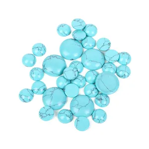 Macro detail of various round turquoise cabochons showing natural matrix and smooth finish