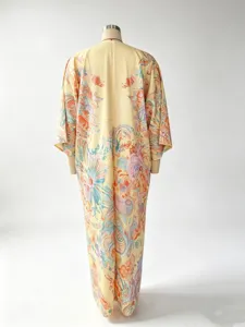 Back detail view of a floral digital print long dress, showing ethnic retro style patterns.