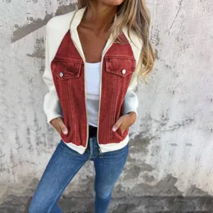Close-up view of a stylish color-block denim patchwork jacket with raglan sleeves.
