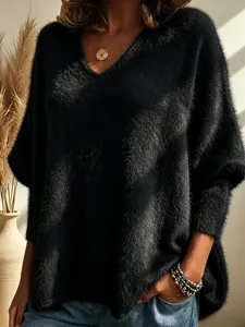 Detailed view of women's soft fuzzy V-neck knit long sleeve sweater in classic black tone.