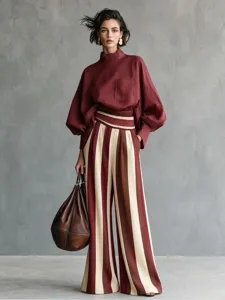 Chic European casual vacation style women's loose suit, burgundy long-sleeve top and striped pants.