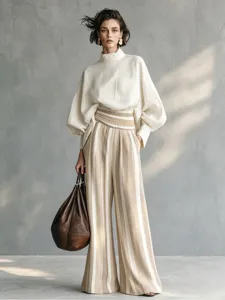 Detailed view of casual resort style women's two-piece set, striped pants and top.