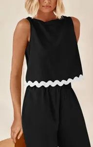 Close-up detail view of the stylish sleeveless crop top featuring a contrast scalloped hem.