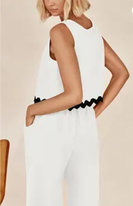 Detailed view of casual two-piece set, sleeveless top with black wave hem and pocket pants.