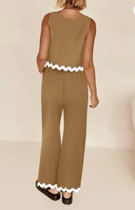 Detailed look at the casual two piece set highlighting the white scalloped hem on top and trousers.