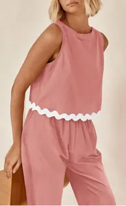 Casual solid color two-piece set featuring a chic sleeveless top and matching loose pants.