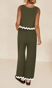 Detailed view of the stylish olive green sleeveless two-piece set with white scalloped hem.