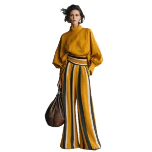 Casual resort style women loose suit with mustard top and striped pants main view