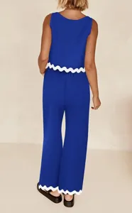 Back view of a blue two-piece set featuring a stylish white scalloped hem detail and relaxed fit.
