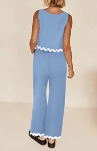 Solid blue two piece set featuring a sleeveless crop top and loose casual pants with cute scalloped trim.