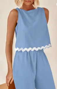 Detail view of solid color casual two piece set featuring a sleeveless crop top and pants.