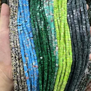 Close-up of various 3x3mm natural stone square cube beads for DIY jewelry making