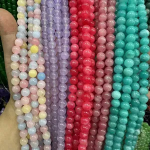 Close-up of 8mm multi-color natural stone beads including strawberry quartz for DIY jewelry